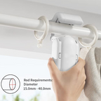 Hand holding a white curtain rod holder against a neutral background