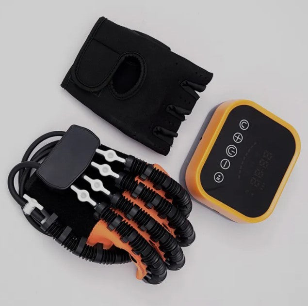 Black and orange resistance band set with a black glove and remote control on a light gray background