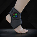 Black ankle support brace with digital display on a foot against a dark background