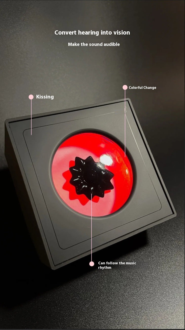 Innovative device with a red and black design on a dark background, labeled with features.