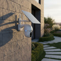Tuya Smart security camera with solar panel on a white background